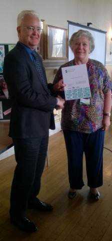 Photo shows Councillor Janet Biggin being congratulated on the Parish Council's achievement by Councillor Matthew Riddle, Leader of South Gloucestershire Council at that time.