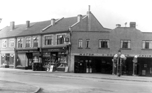 Old Black and white photograph of the old Garage on the corner of Cleeve Hill and Badminton Road